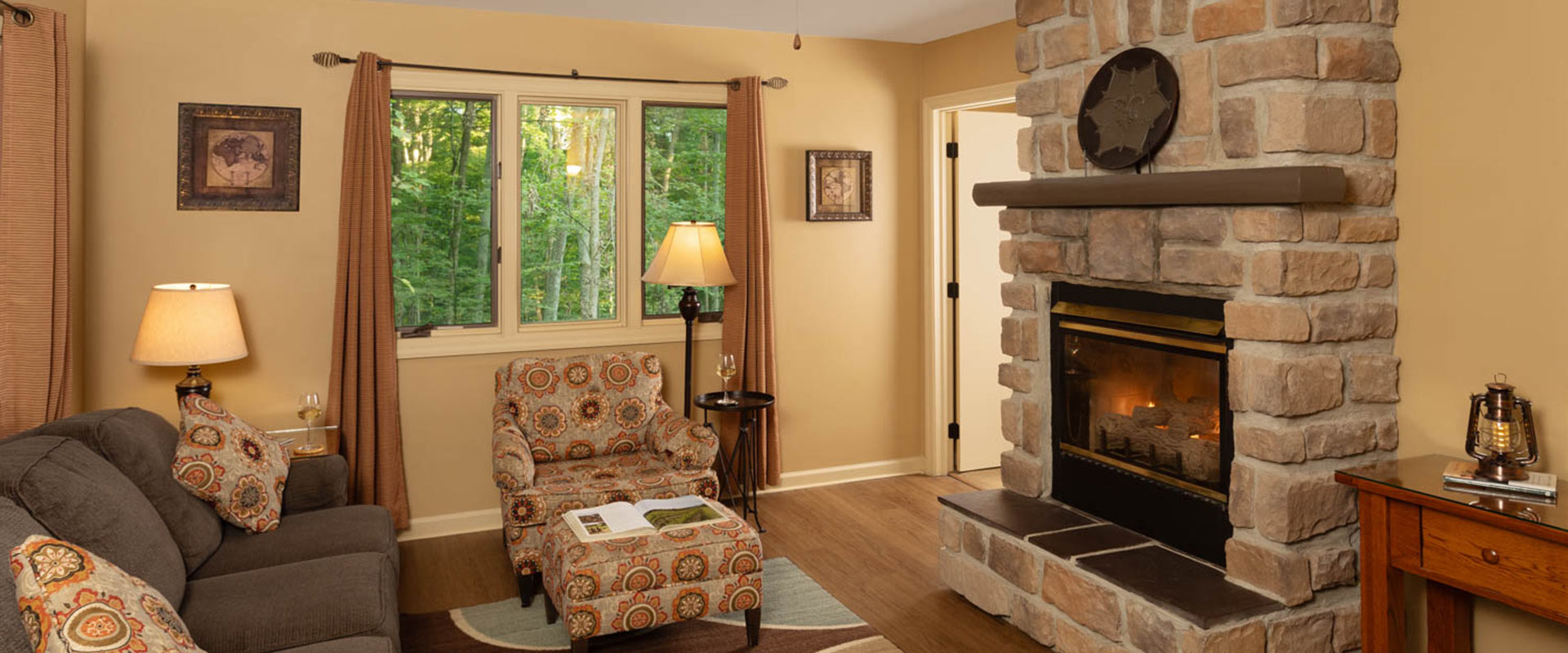 Picture of the sitting area and the fireplace in the Elliot Croft at Glenlaurel.