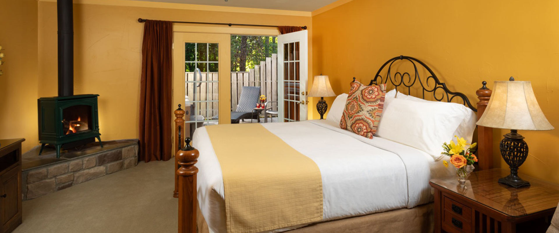 Picture of the bed and fireplace in the MacIntosh at Glenlaurel.
