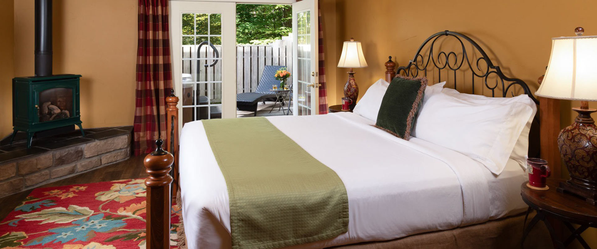 Picture of the bed and the fireplace at the MacTavish at Glenlaurel.