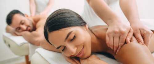Woman getting a massage at a spa.
