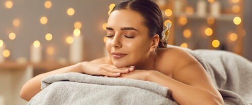 Woman getting a massage at a spa.