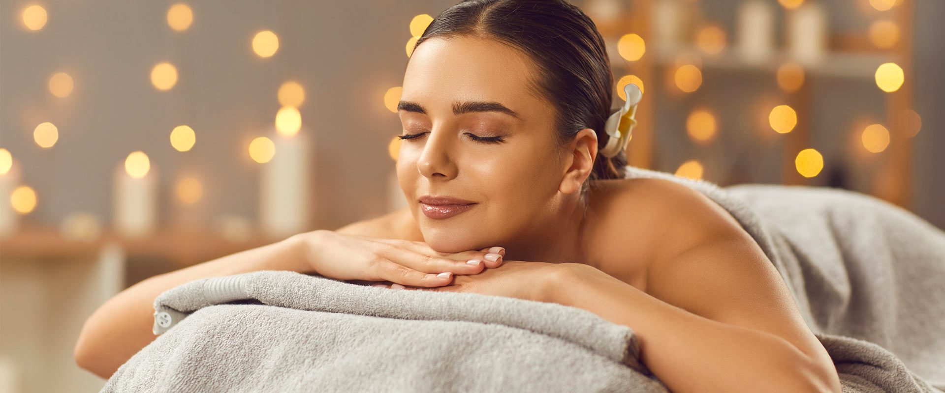 Woman getting a massage at a spa.