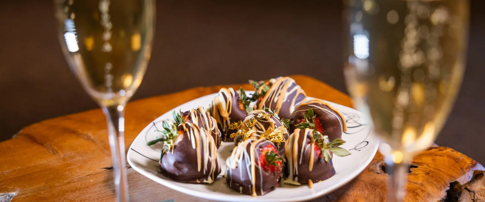 Chocolate covered strawberries and two glasses of champagne.