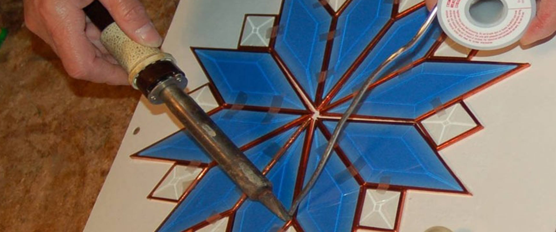 Making a stained glass piece of art.