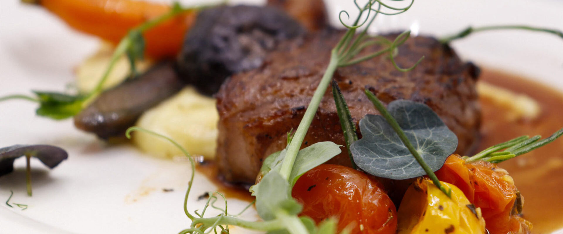 Meat and vegetables on a plate.