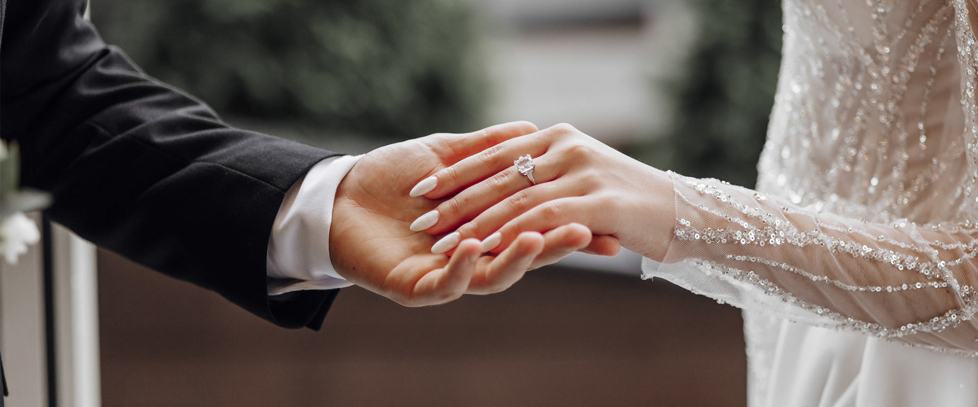 Husband and wife holding hands.