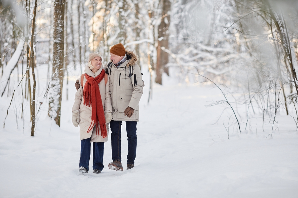Winter couple enjoying a quiet Hocking Hills Winter Hike at our getaway cabins