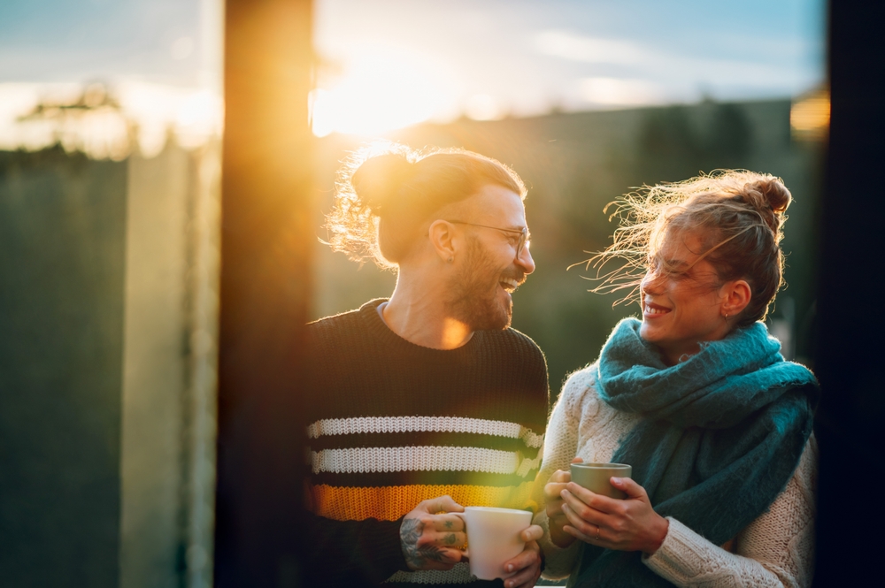 A couple drinking coffee during their Hocking Hills honeymoon getaway