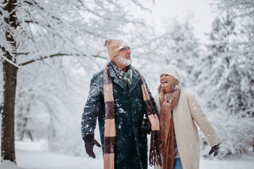 Senior couple enjoying a Romantic snowy walk during their romantic getaways in Ohio