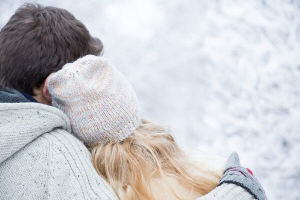 Romantic couple in a snowy scene enjoying one of the best romantic getaways in Ohio